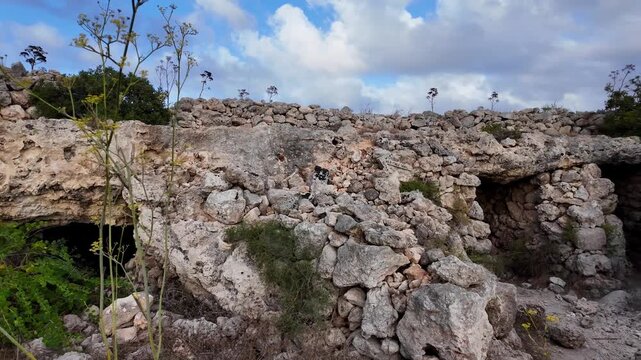 Malta, Xemxija Heritage trail - Entrance of the Punic caves near old farmers hut.
