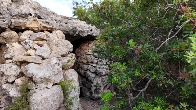 Malta, Xemxija Heritage trail - Entrance of the Punic caves near old farmers hut.