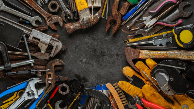 Group of worn work tools. Collection of used and dirty blue collar work equipment. For home improvement, diy repair projects, manual labor jobs, Father's day gift ideas, or to celebrate Labor Day.