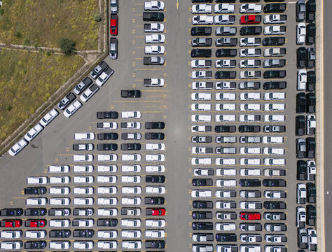 Aerial view of a car factory parking lot filled with rows of new pickup trucks in San Luis Potosi, San Luis Potosi, Mexico.