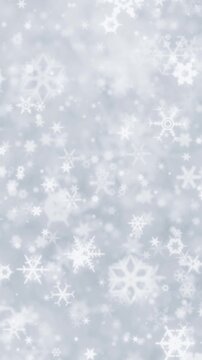 Bright winter scene of glowing sparkling snowflakes. White background with twinkling snow flakes creating wintry atmosphere. Soft snowflakes for winter or Christmas backgrounds.
