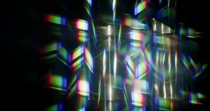 Light ray shining through a prism for angled beams of sparkling shine in brilliant colors. Swirling reflective glass with beaming lights creating visual effect of a brilliant dazzling rainbow. Loop.