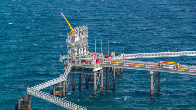 Aerial view of San Felipe Natural Gas Power Plant with its industrial platform and pipelines extending over the blue Caribbean Sea, Boca Chica, Santo Domingo Provinc, Dominican Republic.