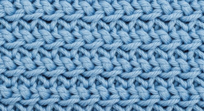 Close up of light blue knitted fabric texture.