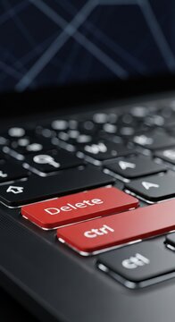 Close up of red delete and ctrl keys on laptop keyboard.