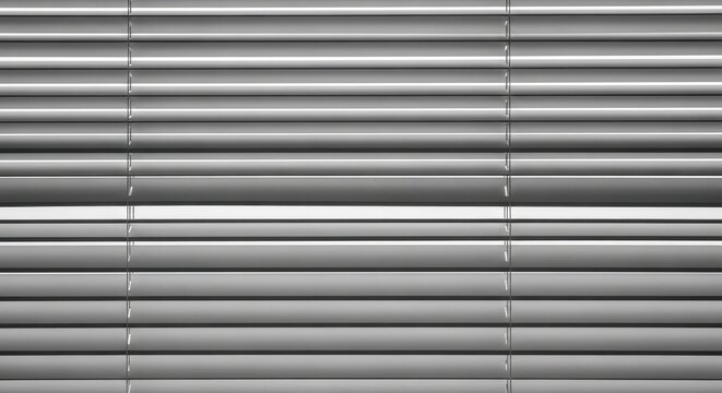 Close up view of metallic horizontal window blinds.
