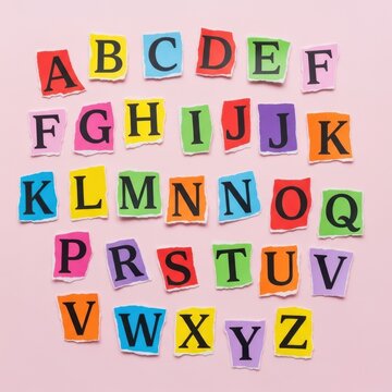 Colorful alphabet letters on pastel pink background.