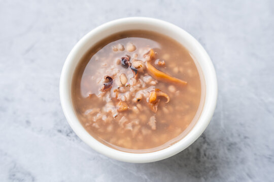 A bowl of cuttlefish, red bean, and Job's tears porridge.