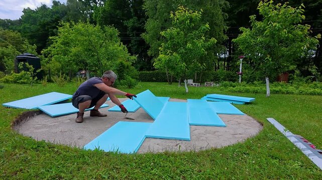 Preparing the backyard for a pool installation by leveling the ground and using foam panels