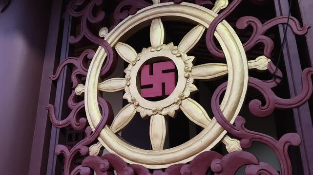 Close up of Buddhist Dharmachakra Wheel of Dharma at My Khe Temple