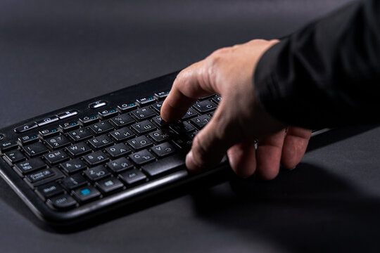 close up of man hand with keyboard. Macro soft focus dolly shot. Computer programming, text chat online messaging and online marketing business concept.
