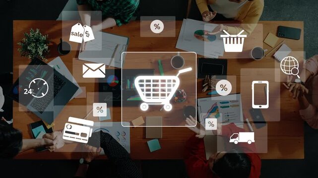 Aerial view of a collaborative office workspace showcasing a shopping cart icon amidst various digital marketing elements, emphasizing teamwork and e-commerce strategies. Raster