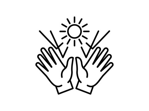 Praying hands with sun rays symbolizing hope and faith