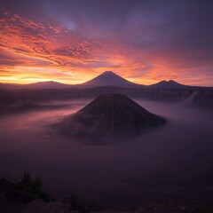 Fototapeta premium Dramatic sunrise sky over Mount Bromo volcano and caldera mist