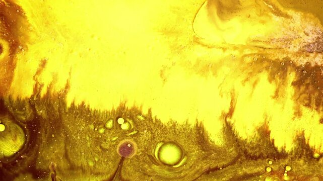 Fine bubbles, shimmering particles (glitter), and fluid flow effects (acrylic pouring) combine to form artistic patterns resembling natural landscapes, biological cells, or tongues of flame.