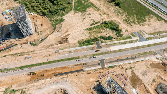 road construction and road infrastructure in the new city residential area. aerial overhead view.