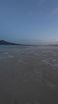 Gentle Waves on Tropical Beach at Twilight