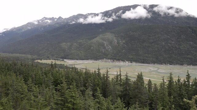 a zoom in clip, looking east, of skakway river at skagway, alaska of the usa