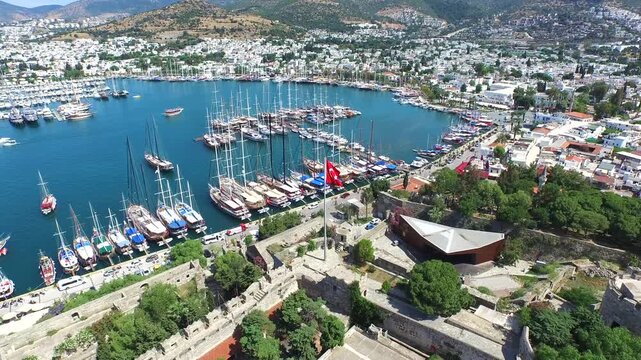Aerial Bodrum Castle above marina and sea boats on Turkeys Aegean and Mediterranean coast.