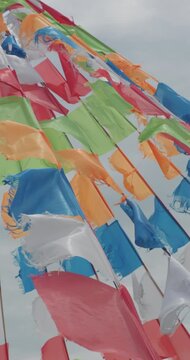 Colorful prayer flags fluttering in wind on Inner Mongolia grassland