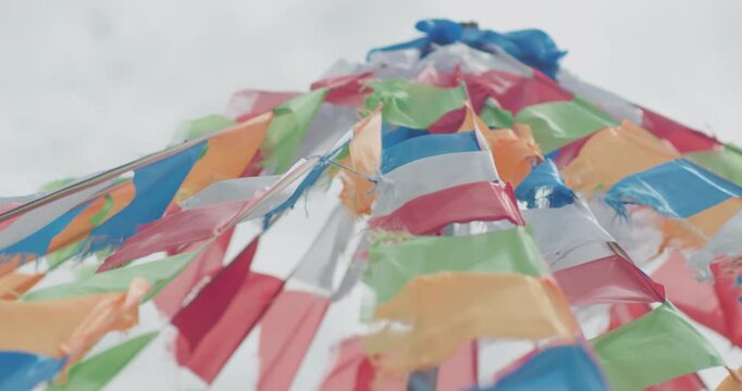Colorful prayer flags fluttering in wind on Inner Mongolia grassland