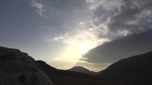 Golestan National Park Iran timelapse across rolling hills, dry valley, glowing sunset sky.