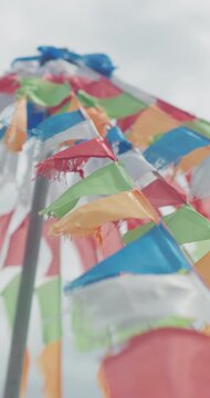 Colorful prayer flags fluttering in wind on Inner Mongolia grassland