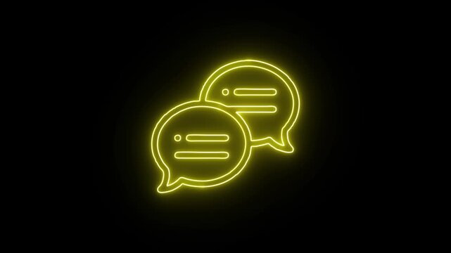 Yellow neon chat bubbles icon flickering on black background symbolizing digital communication and social media messaging.