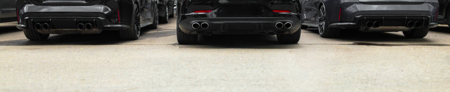 back of three powerful cars