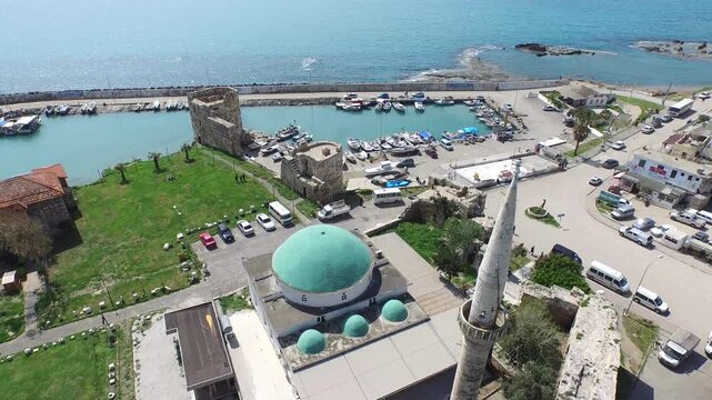 Yumurtalik Adana Turkey seaside mosque and castle harbor show coastal landmark scenery.