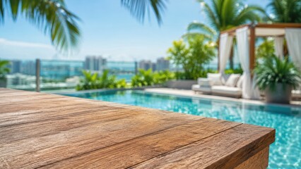 Fototapeta premium Rooftop terrace product display background, empty wooden deck surface with blurred infinity pool, palm trees, cabana and tropical city view