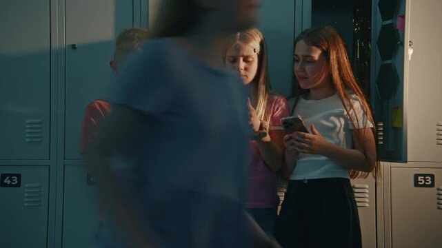 Boy and Two Girls Busy Texting, Playing Mobile Games, or Scrolling Through Social Media During Class Break. Technology Shapes Everyday Communication and Childhood in Digital Age. Digital Lifestyle.