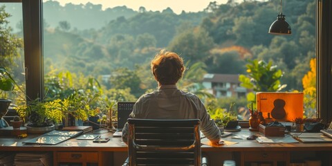 Fototapeta premium A man works from home with a view of nature outside an open window. The concept of remote work, freelancing