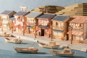 Fototapeta premium Miniature Paper Craft Village Along a Canal in Japan