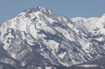 Naklejka premium 妙高山の雪形 跳ね馬 