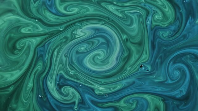 Seamless loop of vibrant emerald green and deep cyan liquid inks swirling slowly and blending in an amorphous abstract motion graphics background