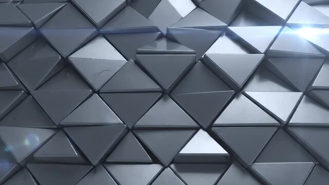 Seamless loop of 3D metallic gray triangles shifting and rotating in a complex geometric pattern with soft shadows and elegant depth