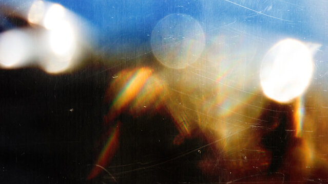 light leak overlay effect with scratch dust and blur light leaks, retro grain noisy film distressed texture light leak flare on black background, grunge dirty distressed blurry light background