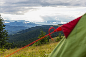 Enjoying a drink in the Carpathians while camping near Kukul © mykhailo