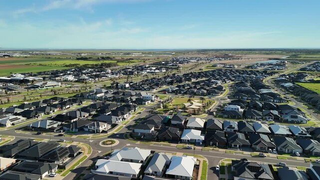 Riverlea Park, City of Playford, South Australia &ndash; 4K aerial drone view of modern housing estate, landscaped entrance, residential development, Port Wakefield roads and Adelaide&rsquo;s northern outskirts.