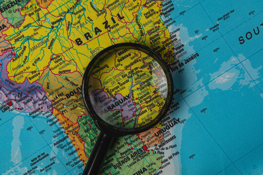 Exploring South America with a magnifying glass on a world map