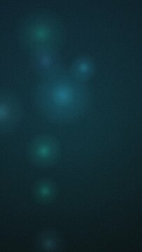 Abstract dark cyan background, with soft glowing, light orbs and, grainy texture for wallpaper