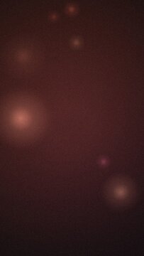 Abstract dark maroon background, featuring soft glowing, circular light orbs, with grainy texture