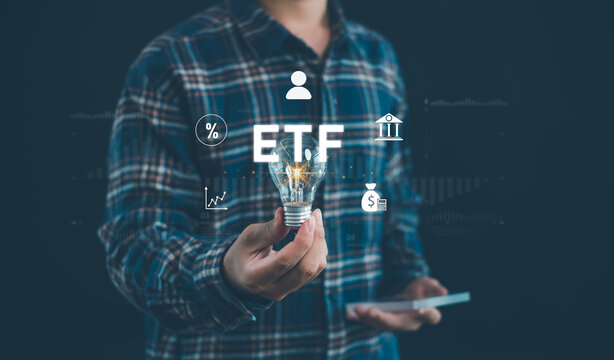 ETF investment concept showing a person holding a light bulb with financial icons, market data and digital technology, representing innovation, portfolio strategy and wealth management.