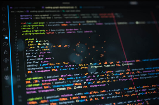 Colorful source code on dark computer screen represents programming, software development, web coding, developer workflow, debugging, application design and modern digital technology.