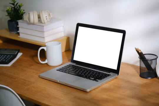 Blank computer screen displayed on a modern workspace desk for a digital mockup.