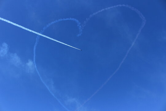 Heart-Shaped Sky Trail Created by an Airplane