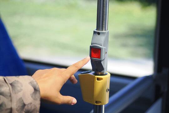 Bus passenger requests stop using button