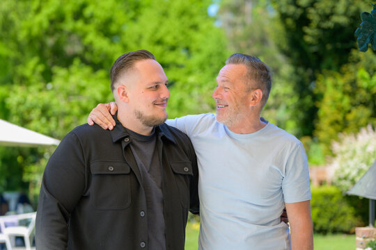 Father Smiling At Adult Son