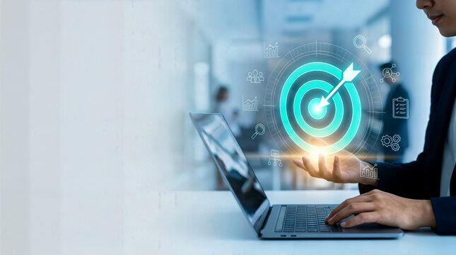 Digital marketing target icon on laptop screen, business strategy and goal achievement concept, professional using computer for data analysis